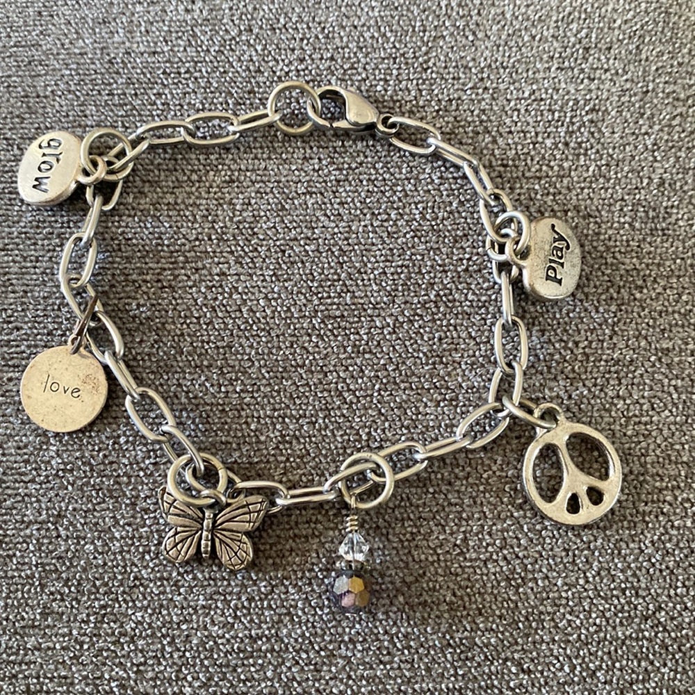 Silver toned bracelet with charms